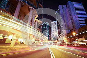 Road light trails on modern city buildings backgrounds in HongKong