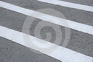 Road line marking made from white thermoplastic material.