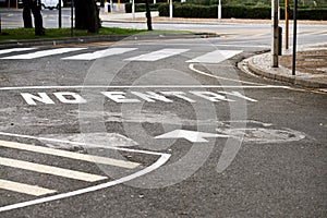 Road marking, no entry and warning with text, arrow and error for direction with paint on asphalt in city. Ground