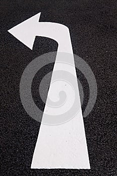 Road marking pointing left