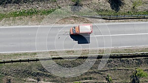 Road marking process while a car works with asphalt.