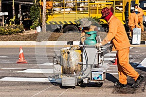 Road Marking Workers at Work Under Scorching Sun.