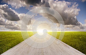 A Road between the meadow with Moving Clouds