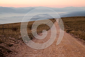 Road and misty mountains