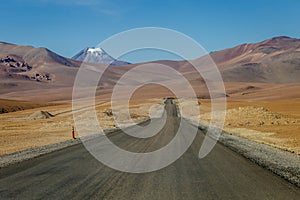 Road in Moon Valley dramatic landscape at Sunset, Atacama Desert, Chile