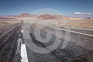 Road in Moon Valley dramatic landscape at Sunset, Atacama Desert, Chile