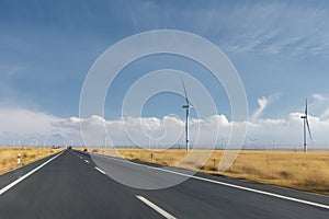 Road motion blur through the wind farm