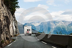 Road with motor home in mountains photo
