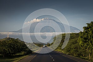 A road with Mount Meru in background, Tanzania photo