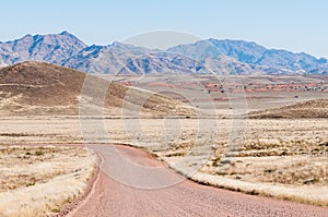 Road and mountain landscape on road C27 in Namibrand