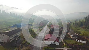 Road in mountain village. Aerial Panorama of Carpathian valley