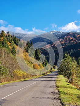 road through mountainous countryside in fall season