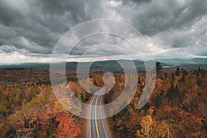 Road in the mountains with autumn color, in Abbot, Maine