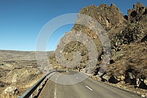 Road in mountains. Blue sky and mountain landscape. Natural location