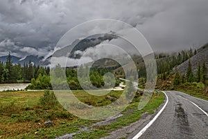 Road mountains fog forest cloudy