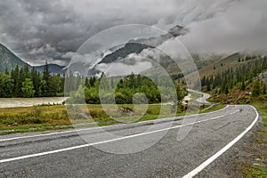 Road mountains fog forest cloudy