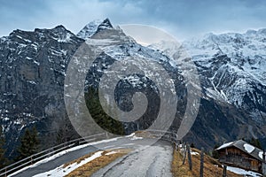 Road in Murren with Jungfrau Mountain on background - Silberhorn and Schwarz Monch parts - Murren, Switzerland photo