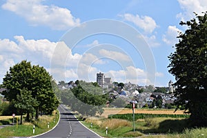 road into MÃ¼nstermaifeld with the church tower above