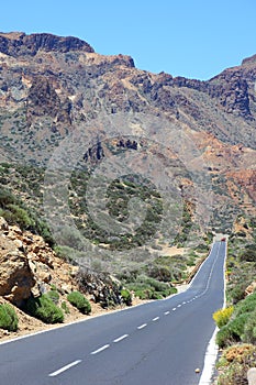 Road in desert highway travel landscape blue sky trip sand mountains volcanic volcano rural lane route sun drive nature rock dry photo