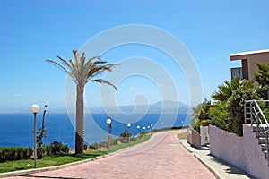 Road near luxury villas and Aegean Sea view