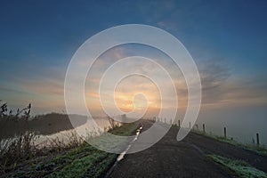 Road in the Netherlands on a misty morning