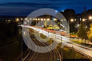 Road at Night by Rails