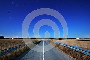 Road at night under moonlight