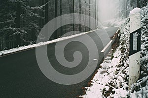 Road through Odenwald Forest in winter