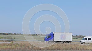 The road outside the city along which trucks travel. Truck driving on the road