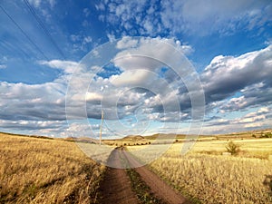 Road over yellow hills