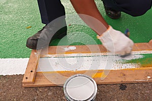 Road painter man worker marking street lines