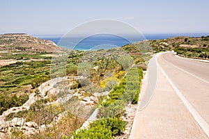 Road and panorama to Ramla beach on the island of Gozo in Malta