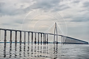 Road passage over water on cloudy sky. Bridge over sea in manaus, brazil. architecture and design concept. Travel destination and