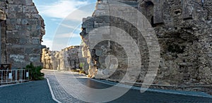 Road passes through the ancient Vespasian Gate in Side, Turkey