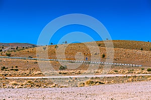 Road passing through rolling hills.