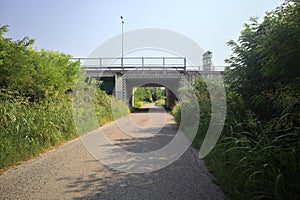 Road passing under a bridge