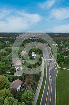 Road Past Houses Leads to Horizon