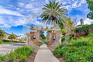 Road pathway and gate at the entrance of neighborhood in Huntington Beach CA