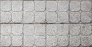 Road paved with sidewalk tiles. texture of light gray bricks