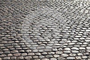 road pavement made with many smooth pebbles without people