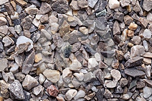 Road and plaster grit, loose chippings, crushed stone, surface, macro photo