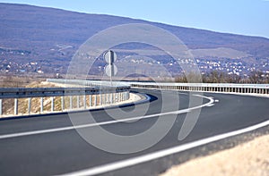 Road with protective metal fence