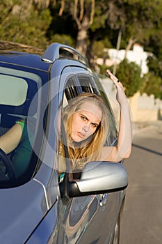 Road rage, angry woman in car photo