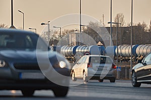 Road and rail transportation, oil freight wagons and cars passing