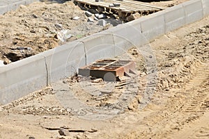 Road and rain drain in the city during renovation and modernization. Summer. Day