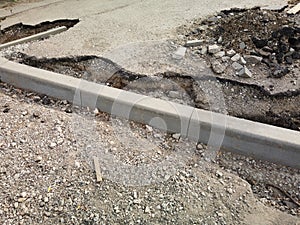 Road reconstruction. New curbstone installed and ready to be fixed with concrete, Road works.