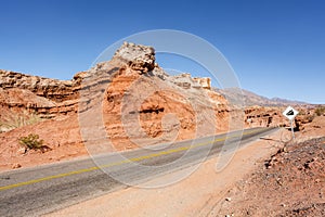 Road through the red rocks of Quebrada de Cafayate, Salta, Argentina