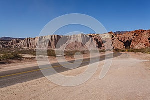 Road through the red rocks of Quebrada de Cafayate, Salta, Argentina