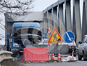 Road repair on the bridge in winter