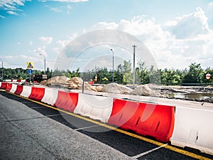 Road Repair, Sand piles and fencing barriers and traffic cones, highway asphalt improvement